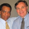two men smile together