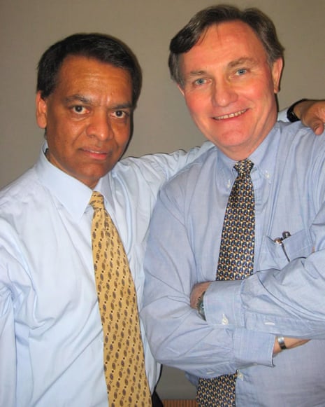 two men smile together