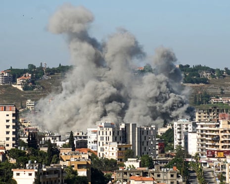 Smoke rises above buildings in a densely built-up area of Nabatieh