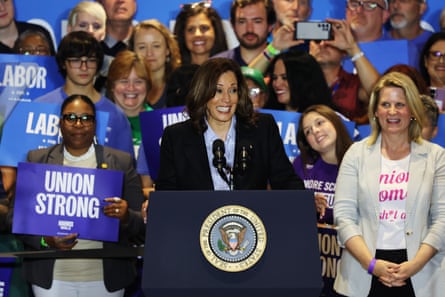 a women stands in front of crowd