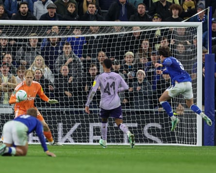 Hayden Hackney volleys the ball into the net past a diving goalkeeper to score