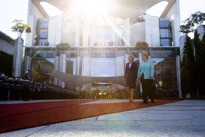 theresa may visits angela merkel in