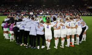 England players huddle after the semi-final win over Sweden.
