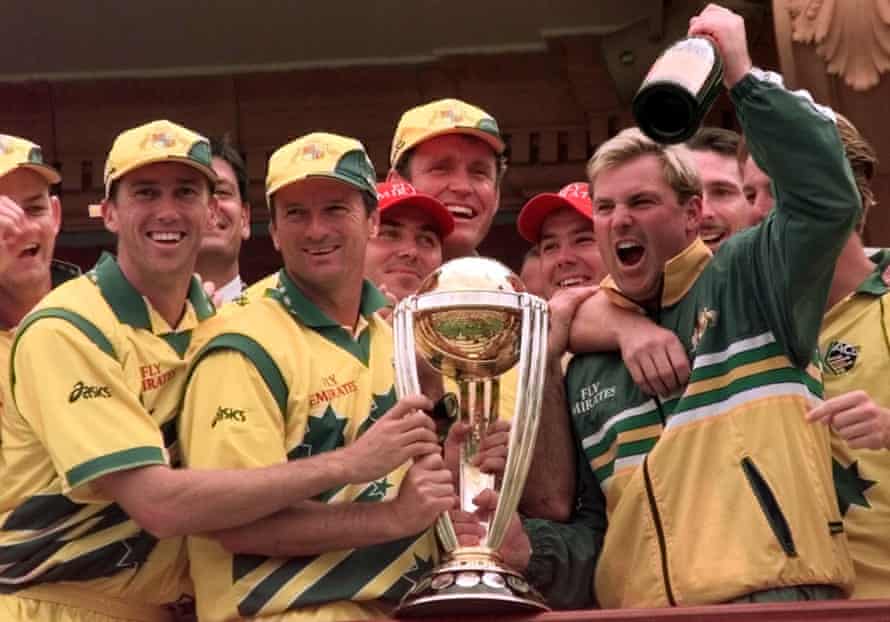 Shane Warne, with Steve Waugh holding the trophy, celebrates winning the 1999 World Cup with Australia teammates on the Lord’s balcony