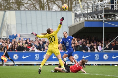 Sam Kerr of Chelsea scores her team's first goal past Mary Earps.