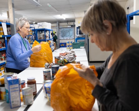 Volunteers packing bags at Canterbury food bank