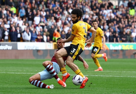 West Ham United's Emerson Palmieri fouls Wolverhampton Wanderers' Rayan Ait-Nouri to concede a penalty.