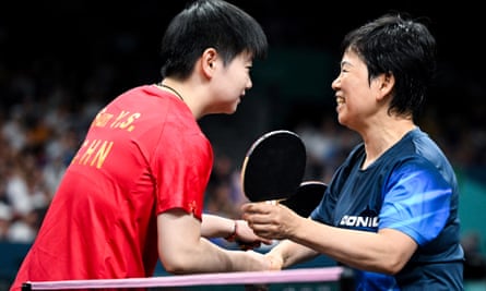 World No 1 Sun Yingsha (left) is congratulated by Ni Xia Lian after her 4-0 victory
