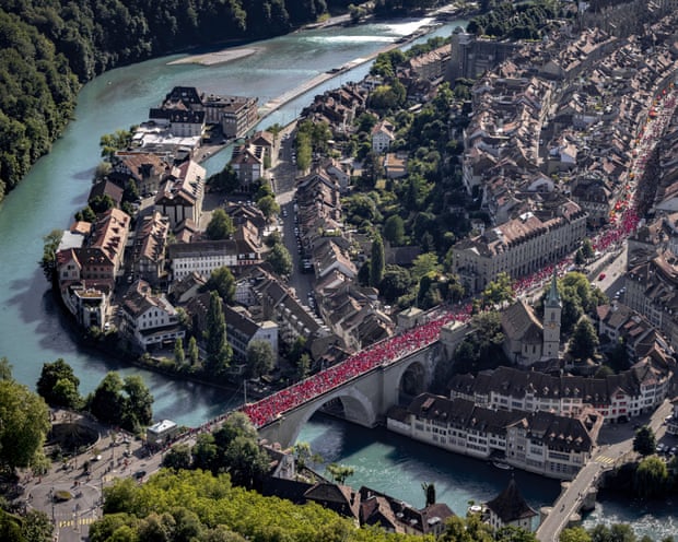 An aerial shot in Switzerland, with thousands of people crossing a bridge