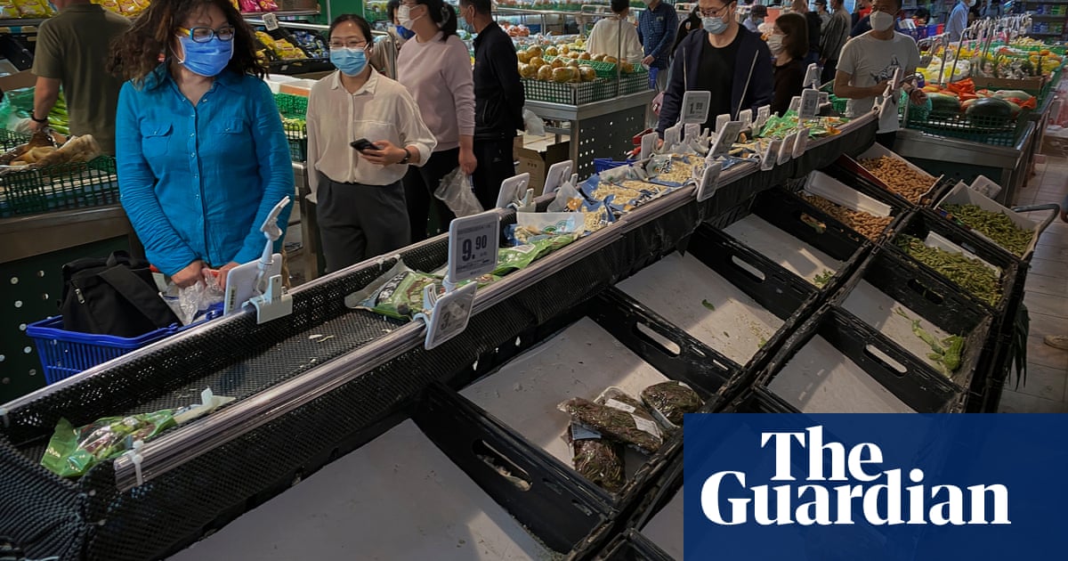 Beijing residents stock up on food amid Covid lockdown fears – video