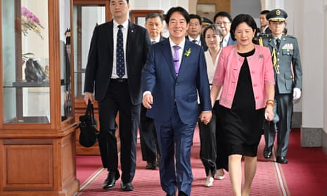 Taiwan's President-elect Lai Ching-te (front L), incoming First Lady Wu Mei-ju (front R) and Vice President-elect Hsiao Bi-khim (C, second row) arriving at the Taiwan Presidential Office for the inauguration ceremony in Taipei on 20 May 2024.