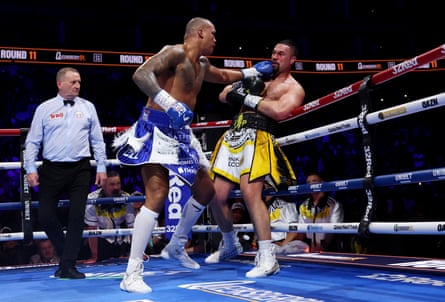 Fabio Wardley knocks back Joseph Parker, watched intently by the referee