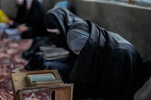 A Kashmiri Muslim girl attends recitation classes of the holy Quran during the fasting month of Ramadan in Srinagar, India