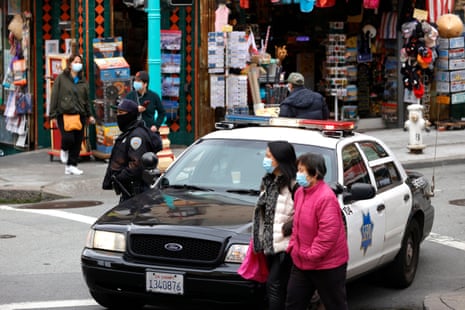 A San Francisco police officer stands guard on Grant Avenue in Chinatown on Wednesday.