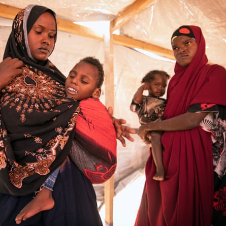 Hani Ali Osman with her three-year-old son, Suliman, at the Degaan IDP camp in Galkayo.