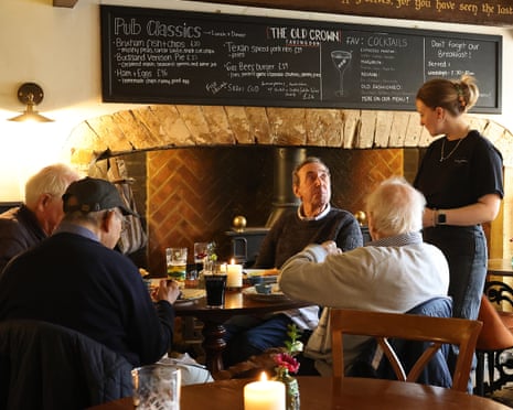 A historic pub with wooden beams and cozy corners