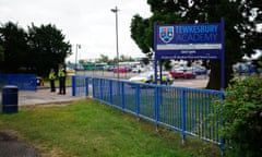 Police officers stand at the gate of Tewkesbury academy