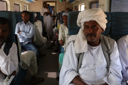 Abdelhalim Tayeb (right) riding the train from Khartoum to Atbara