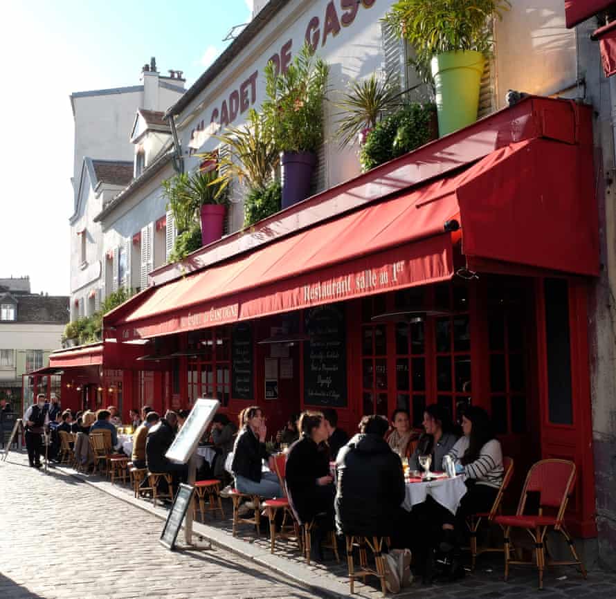 Parisians enjoy afterwork drinks at a bar on the Place Tertre in the Montmartre district of Paris on the first day of the lifting of Covid-19 restrictions.
