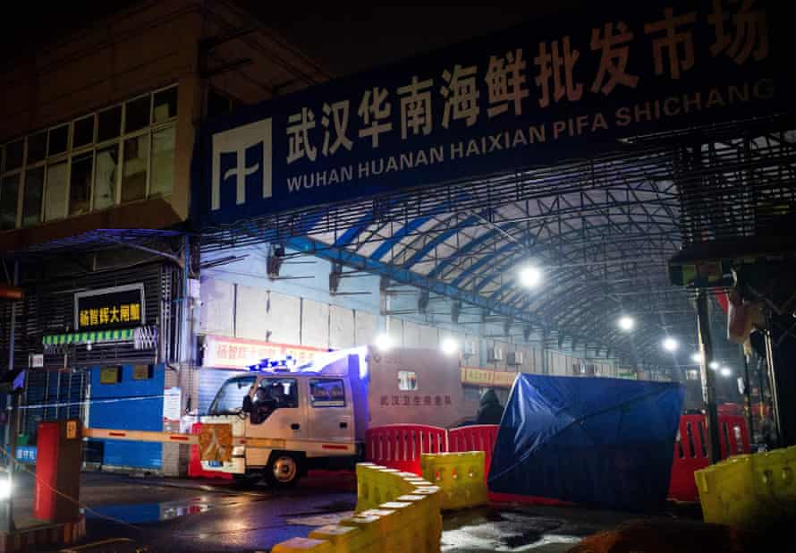 The Wuhan hygiene emergency response team leave the closed Huanan seafood wholesale market on 11 January 11.