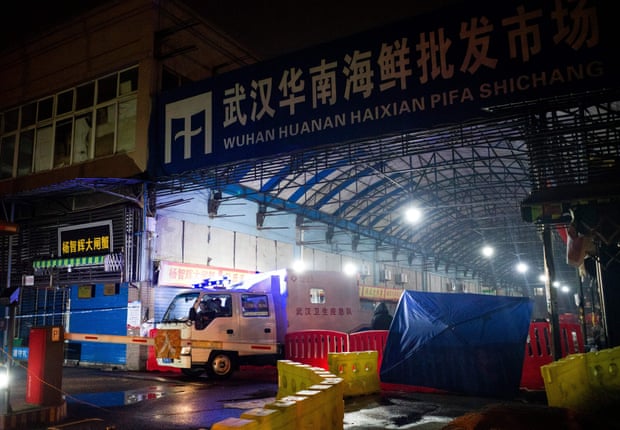 The Wuhan hygiene emergency response team leave the closed Huanan seafood wholesale market on 11 January 11.