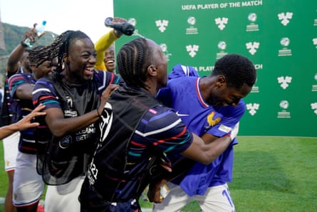 Djaoui Cissé is mobbed by teammates after he wins man of the match