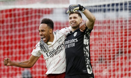 Arsenal’s Emiliano Martínez celebrates Arsenal’s Community Shield win against Liverpool with Pierre-Emerick Aubameyang.