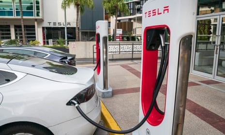 Tesla cars at a charging station