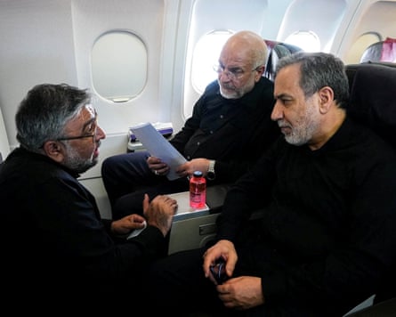 Mohammad Bagher Ghalibaf and Abbas Araghchi talking while sat on an airplane