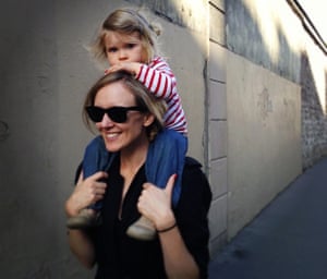 Jayne Tuttle, the author, with her daughter on her shoulders in Paris