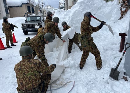 Soldiers clear snow