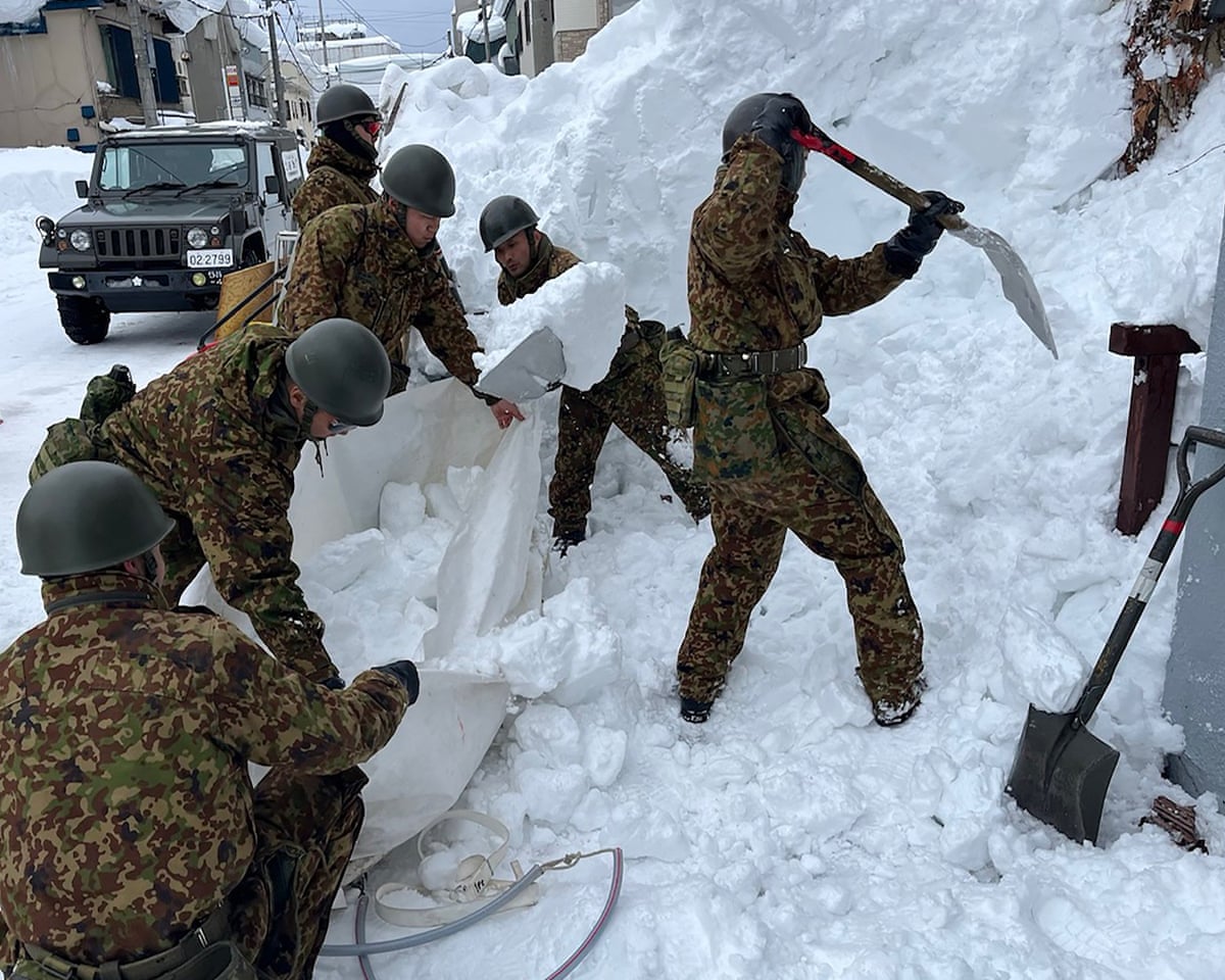 Dozens dead after record snow in Japan – and officials warn warmer weather will be treacherous | Japan | The Guardian