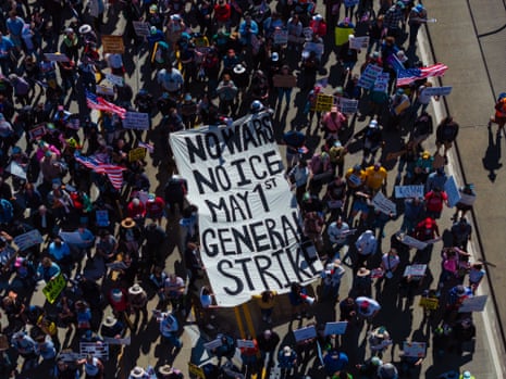 People holding a banner reading ‘No war, no ICE, May 1st general strike’