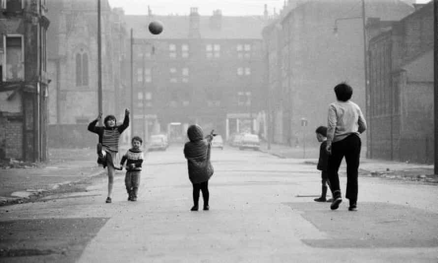 children play on a Glasgow street.