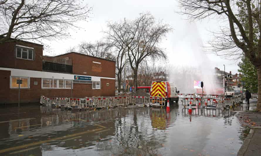 A burst water main on Jamica Road in Bermondsey, south east London which caused flooding in the road by a polling station