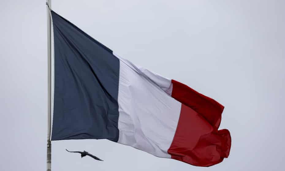 The French national flag flying at the entrance of the Elysee palace in Paris.