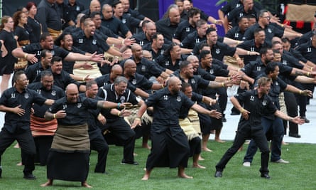 Former Wesley College students perform a haka as Jonah Lomu’s casket leaves the field at the public memorial.