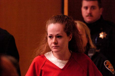 Christa Pike in an orange jumpsuit as she walks into court.