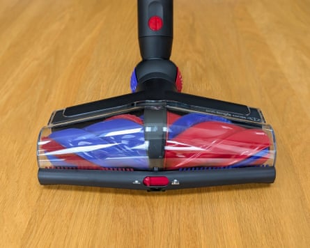 The head of a Dyson V16 vacuum cleaner on laminate wood flooring