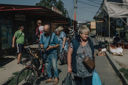 A market in Pokrovsk. Russian troops are six miles away.
