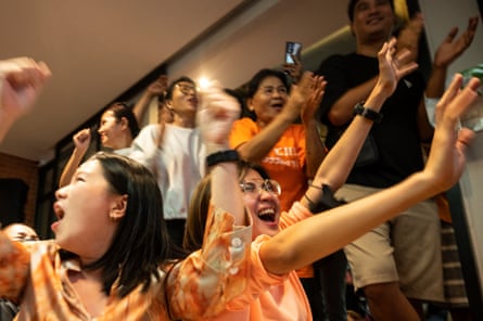 Supporters of Move Forward Party react to the election results