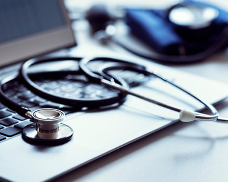 A stethoscope placed on a laptop computer