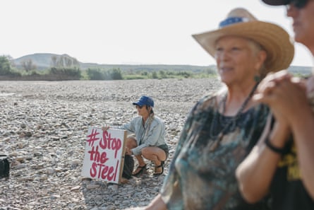A woman holding a sign.