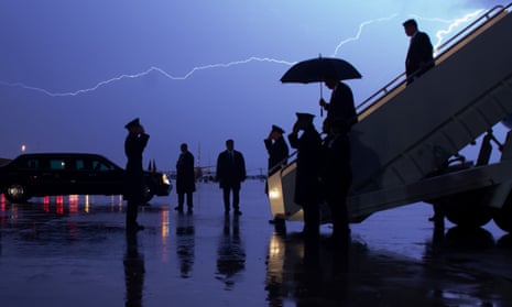 Donald Trump disembarks Air Force One as lightning splits the sky at Joint Base Andrews in Maryland, in August 2020.