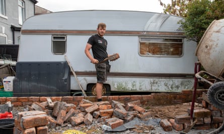 Steven Heneghan has volunteered to rebuild walls that were destroyed by the far right during riots.