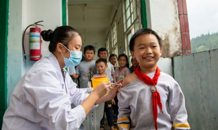 A child receives a dose of a Covid vaccine at a school in Guizhou province last week.