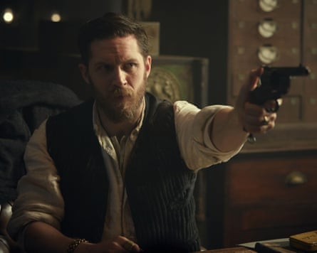 Man in waistcoat pointing a revolver