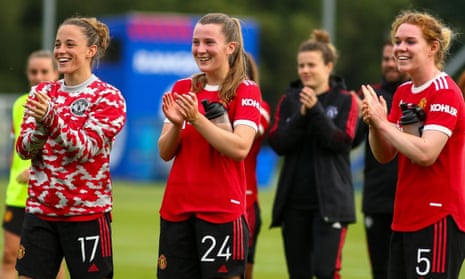 Ona Batlle (left), Carrie Jones (middle) and Aoife Mannion salute the Manchester United fans at the recent friendly against Rangers. 