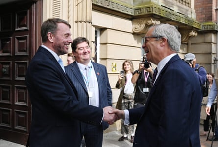 Atkinson welcomes Nigel Farage to county hall in Preston in June this year.