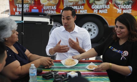 The Democratic presidential candidate Julián Castro speaks with Lupe Arreola, left, Astrid Silva, right, and others while visiting a taco truck, 28 February 2019, in North Las Vegas, Nevada.